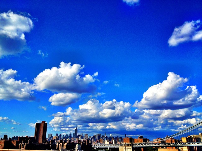 view of the new york skyline from the manhattan bridge.