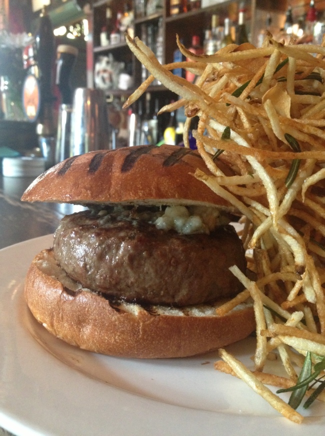 delicious cheeseburger from 'the spotted pig. the blue cheese is quite sharp but leaves a memorable taste.